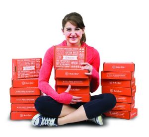 kelsey_sitting_boxpiles